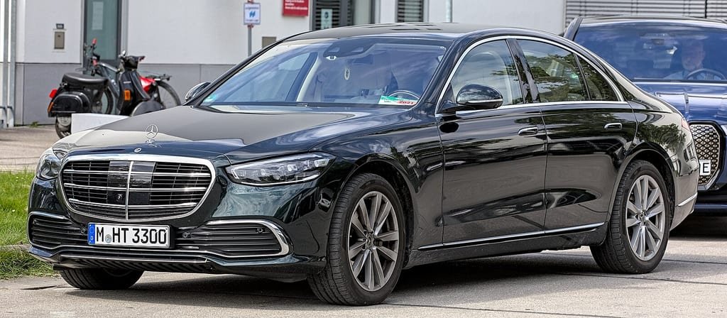 Black Mercedes-Benz S-Class saloon parked on a city street